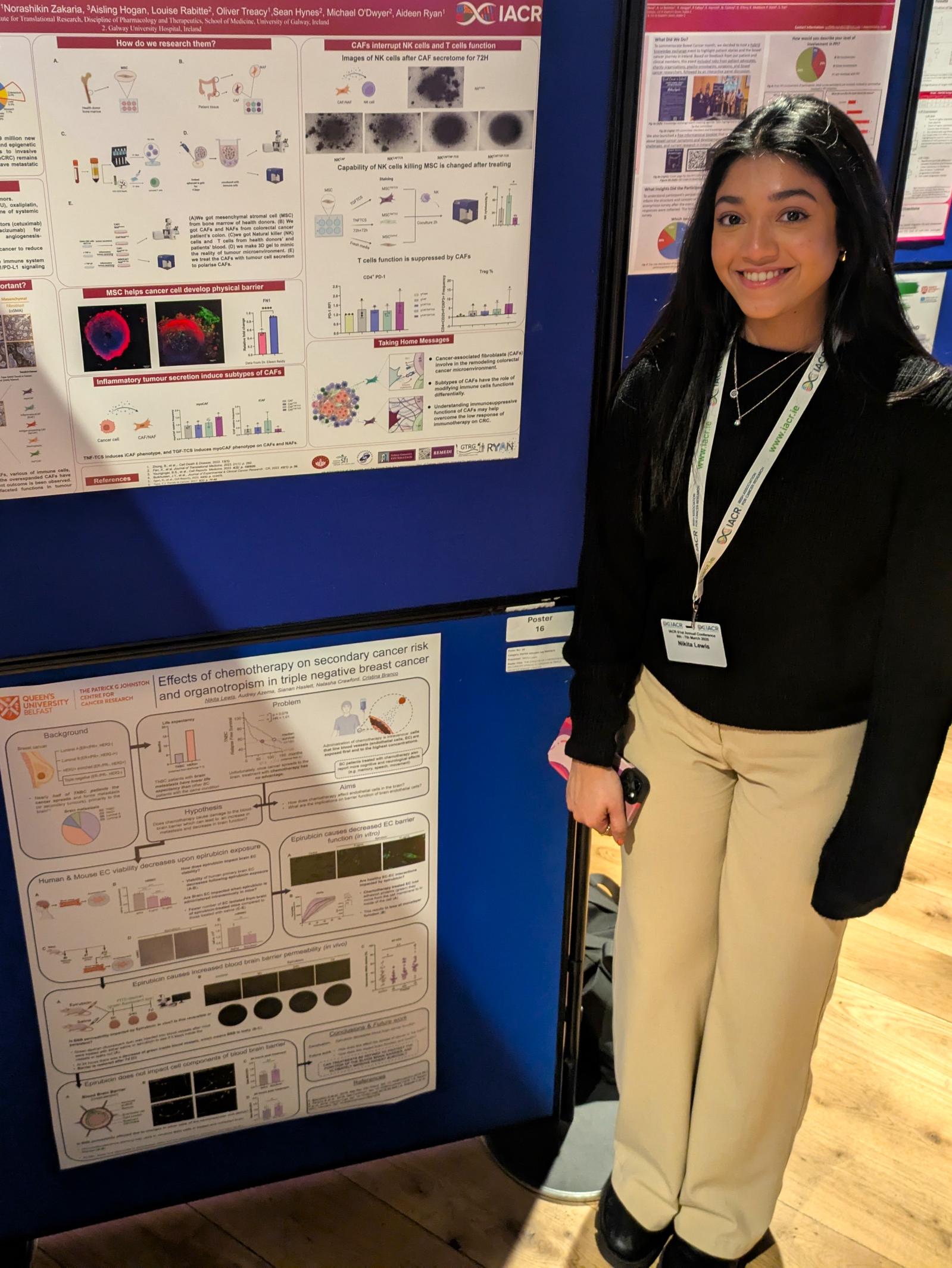 Nikita Lewis stands beside her poster at the Johnston Award Poster session